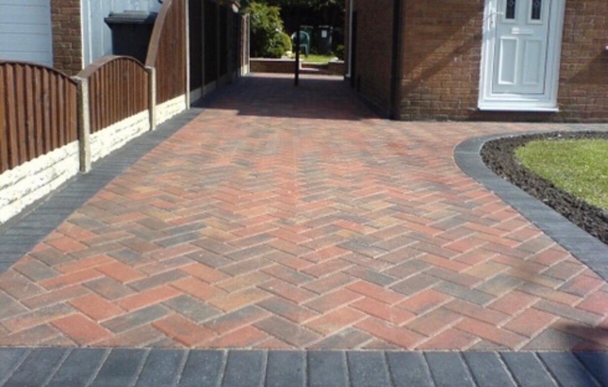 Red herringbone block paved side passage