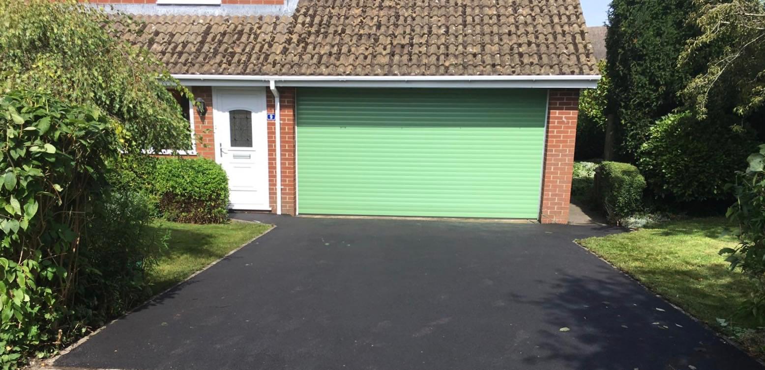 Wide view of a tarmac driveway at a Swindon home